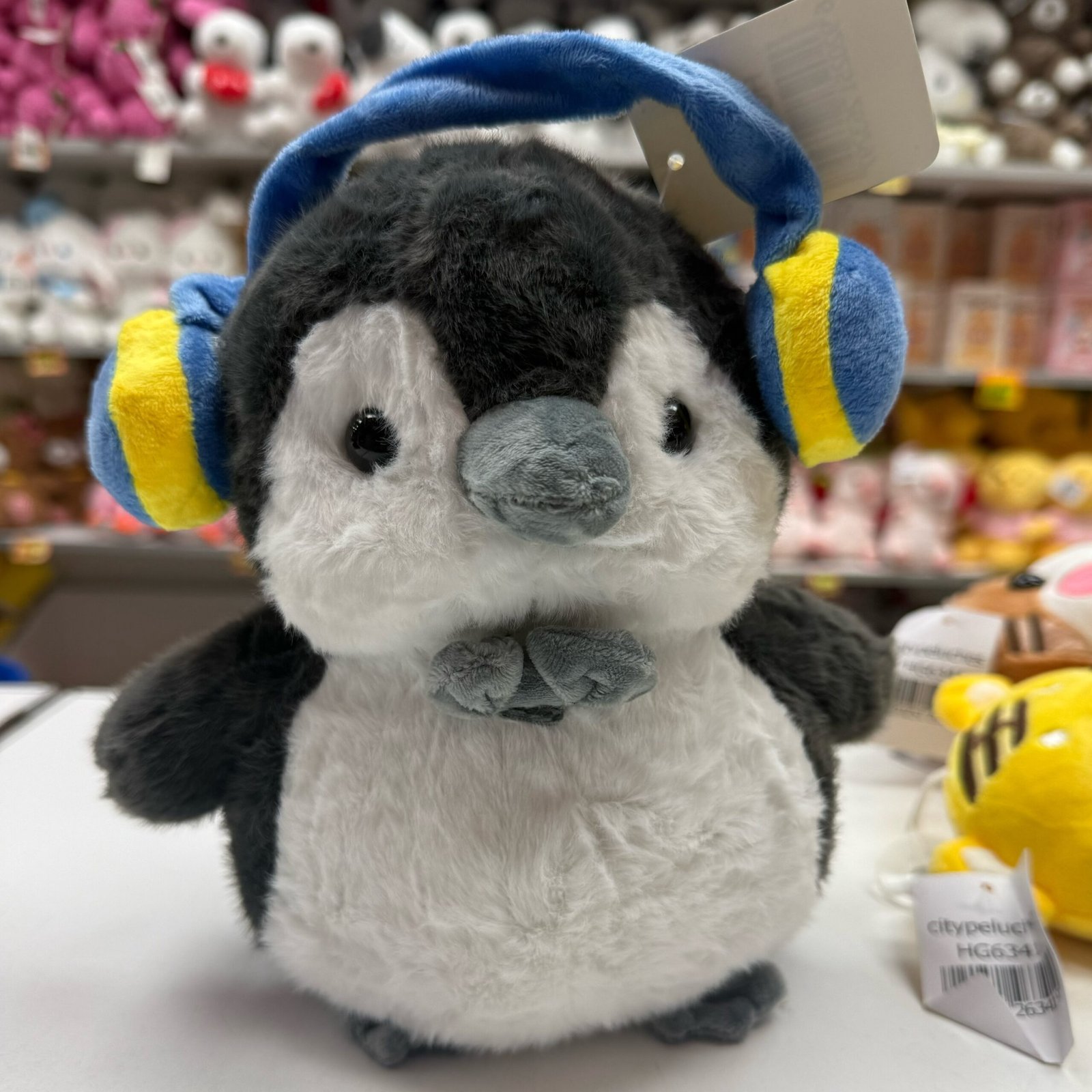 pinguino c/auriculares 26cm